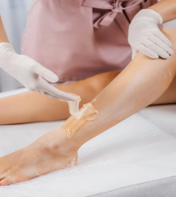 young-womans-legs-wax-with-shugaring